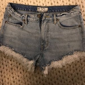 Free people jean shorts with lace trim